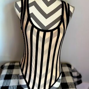 Sheer bodysuit with black lines running through it.